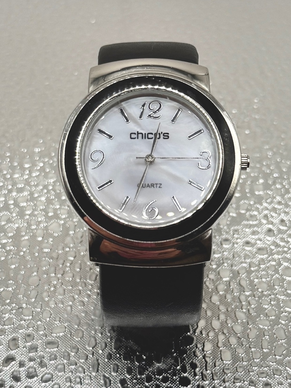 Chico Woman’s Quarts Cuff Watch Silver Tone ,Black Leather, Mother of Pearl Face